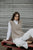 Half Cardi Relaxed Vest By Bella - Latte